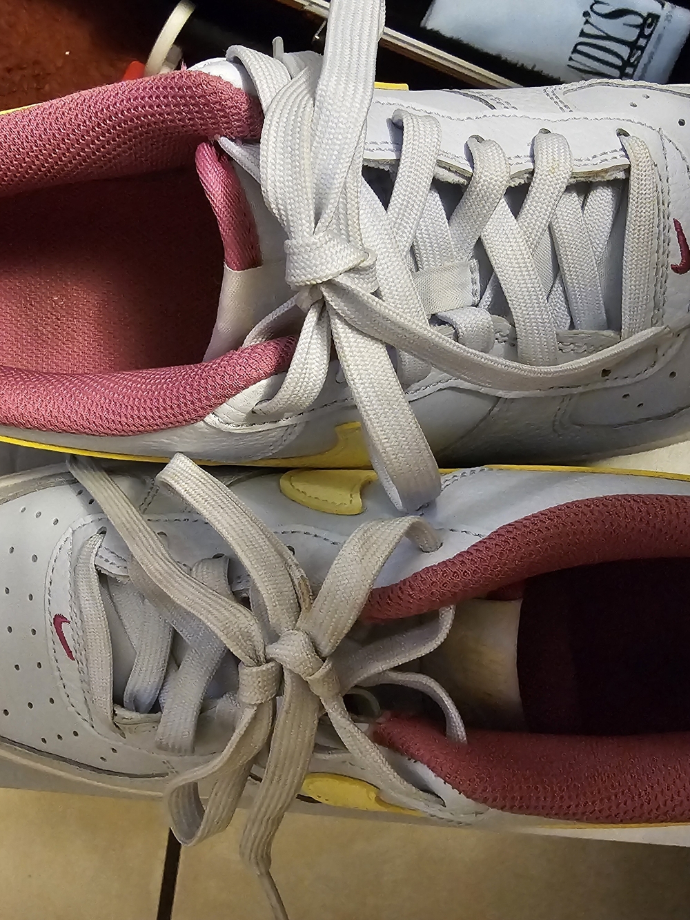 Nike Kids White Sneakers with Pink Lining and Yellow Accents